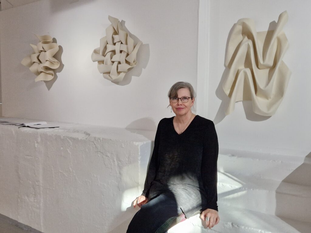 Anneli Nowén with her textile artworks